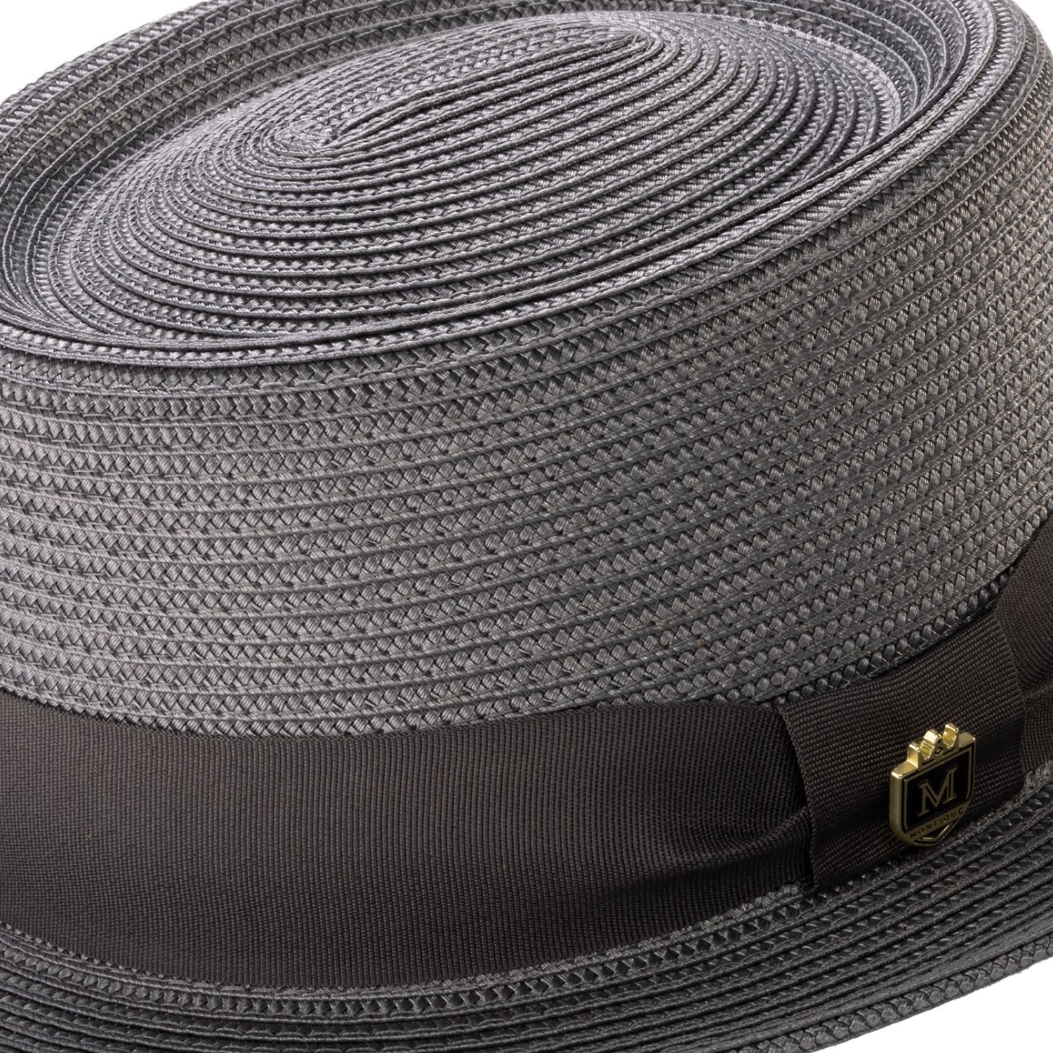 Close-up grey hat band and crest pin