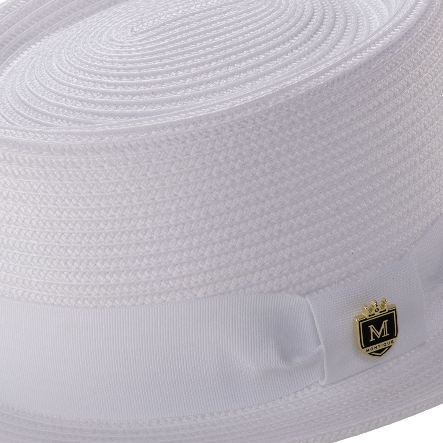 Close-up white hat band and crest pin