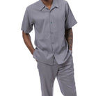 Side view of a male model wearing the grey  linen look walking suit 
