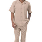 Side view of a male model wearing the blush short sleeve walking suit and matching trousers.