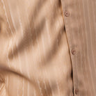 Close-up of beige textured cable knit design fabric on a Montique men's walking suit shirt