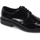 Close-up of black leather cap-toe and intricate laser-cut perforated pattern.