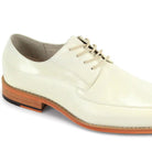 Close-up of cream embossed leather texture and moc toe stitching detai