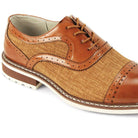 Close-up of maple leather brogue detailing and textured golden-brown tweed fabric.
