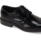 Close-up of black leather dress shoe showcasing coco print texture and moc toe construction