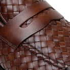 Close-up of the antique tan handwoven calfskin penny loafers