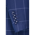 Close-up of the blue windowpane-check jacket sleeve, showing four blue cuff buttons and pale grid lines.
