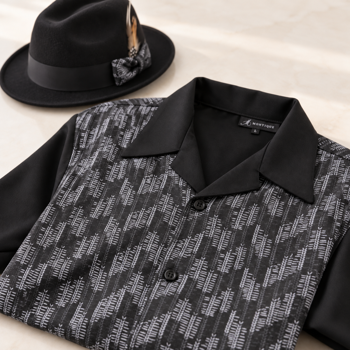 Montique black and white patterned walking suit shirt with smooth black open collar, neck label and black fedora styling prop.