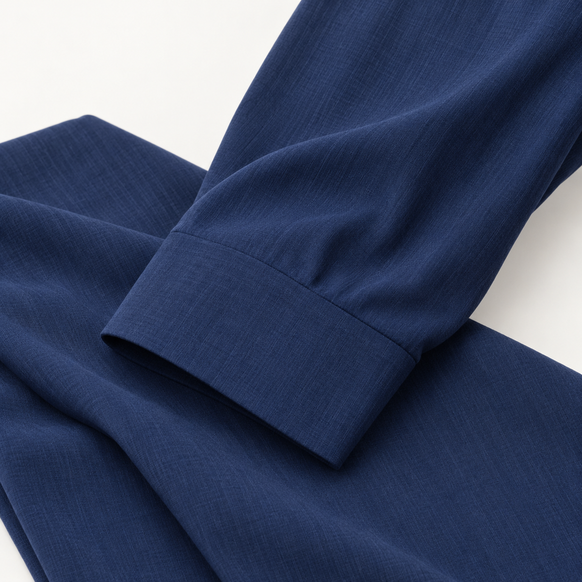 Montique navy solid walking suit sleeve cuff and matching trouser fabric close-up
