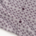 Montique plum geometric walking suit patterned fabric and matching button detail