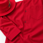 Montique red walking suit pocket and cuff beside red fedora styling accessory