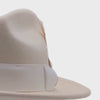 White wool felt fedora hat back view with pinched crown, white ribbon band, smooth felt finish, and wide brim