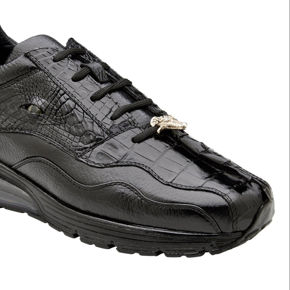 Close side view of black caiman leather sneaker