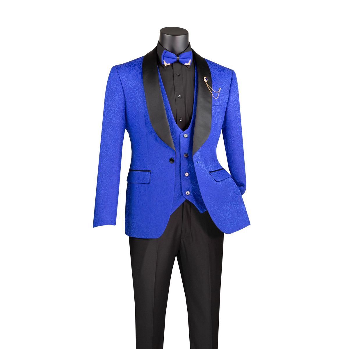 Royal blue jacquard tuxedo jacket with black shawl lapels, a blue vest and black trousers, front view.